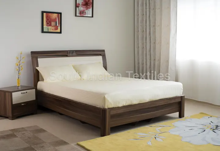 Light blue cotton bedding on a double bed