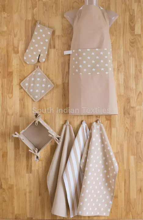 Beige cotton apron, oven glove, potholder, bread basket and tea towels